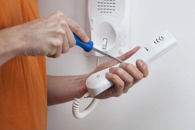 Communal door entry panel being serviced on a North London block