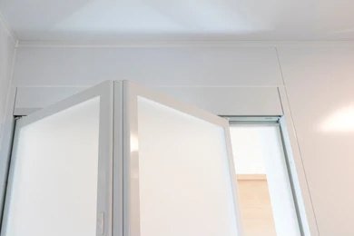 N1 Locksmiths engineer aligning a bi-folding door run in North London