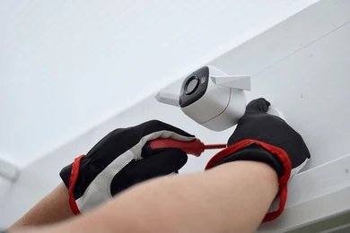 Adjusting a CCTV camera angle to avoid a neighbouring garden in North London